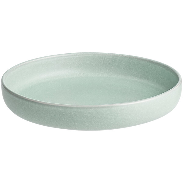 A round, shallow bowl with a matte light blue finish.