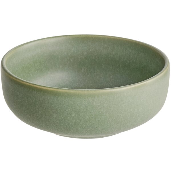 A round, sage green bowl with a matte finish.