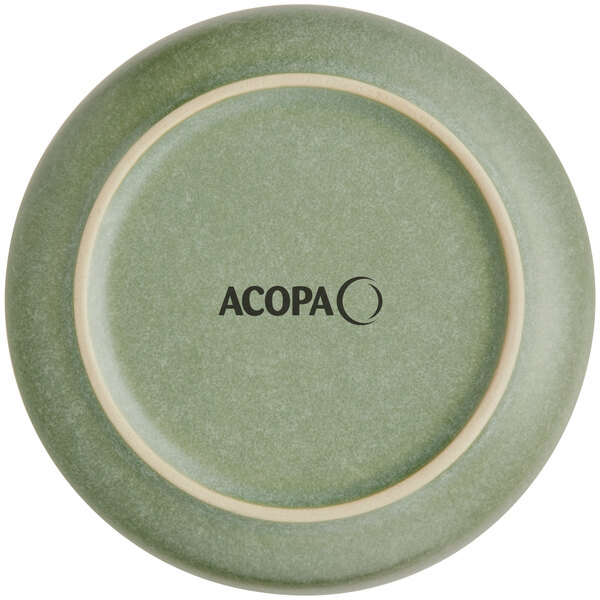 A green, round saucer with a matte finish and the word 'ACOPA' printed on the bottom.
