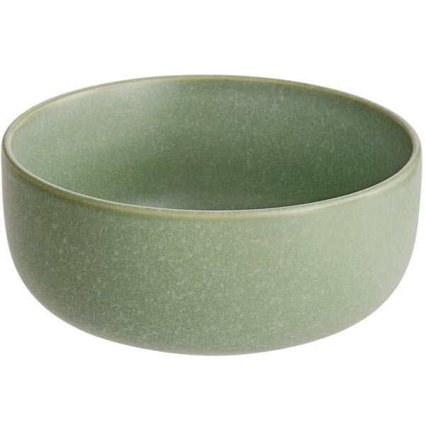 A round, sage green bowl with a matte finish and smooth texture.