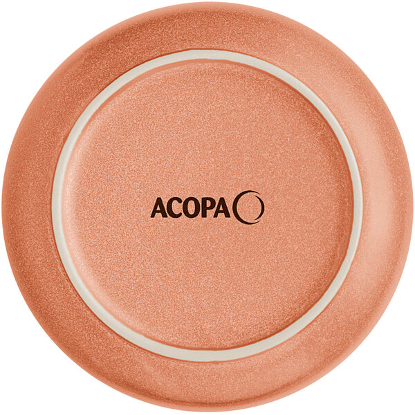 The image shows the bottom view of a round, terra cotta-colored saucer with a matte finish and the word 'ACOPA' printed in the center.