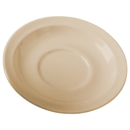 A tan SuperMel saucer with a round edge.