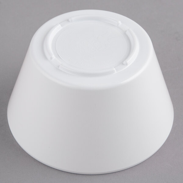 A white bowl on a gray background.