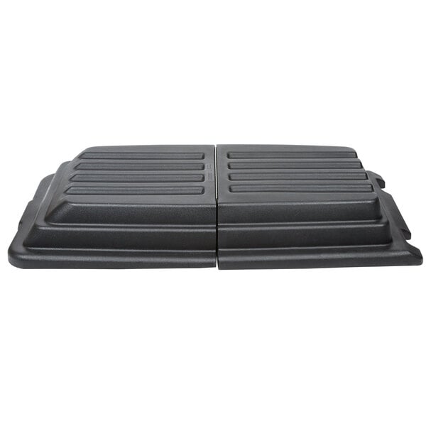 A black rectangular Rubbermaid lid with lines.