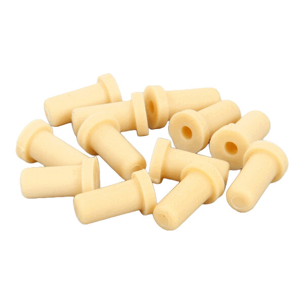 A set of twelve beige cylindrical water plate plugs with flanges, used for Kold-Draft machines.