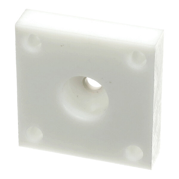 A white square plastic spacer block with a central hole and four corner holes, used for remote mounting in Frosty Factory equipment.