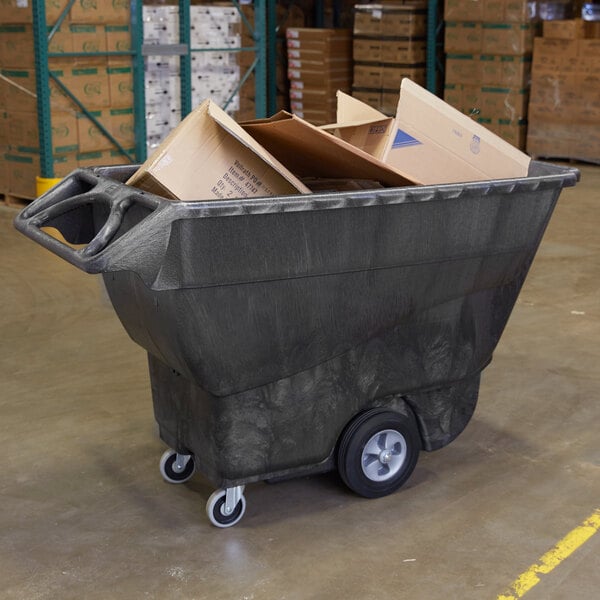 A large black Rubbermaid tilt truck full of cardboard boxes.