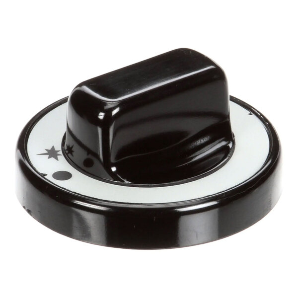 A black and white gas valve knob for controlling a gas appliance.