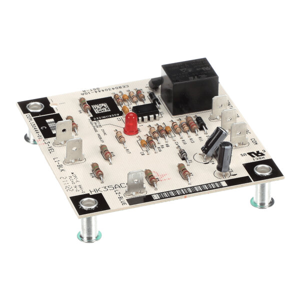 A square electronic relay phase monitor circuit board with various resistors, capacitors, a relay, and a red LED, mounted on four standoffs.