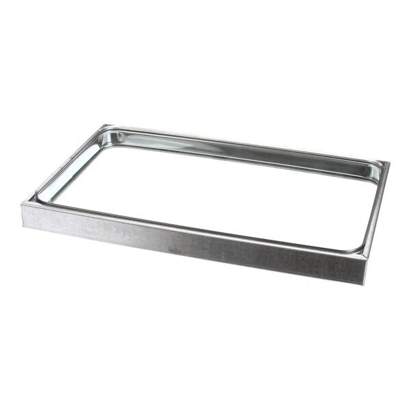 A rectangular metal oven window frame.