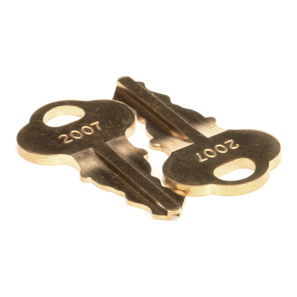 A pair of brass keys labeled with the number 2007.