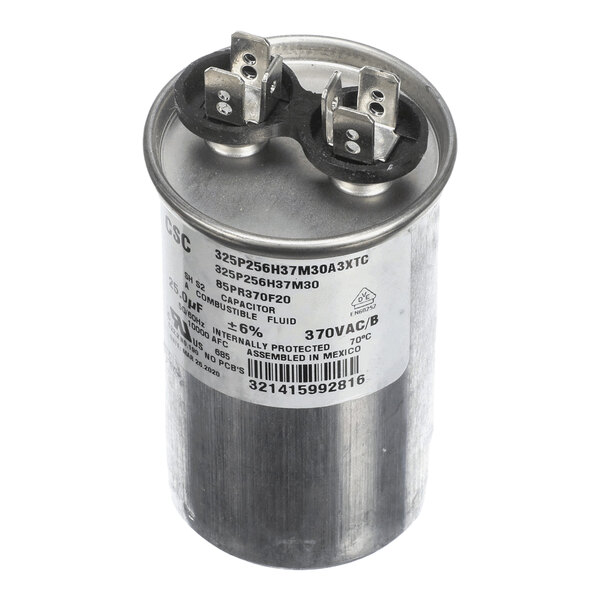 A cylindrical metal run capacitor labeled for 25 microfarads at 370 volts, used in electrical equipment.