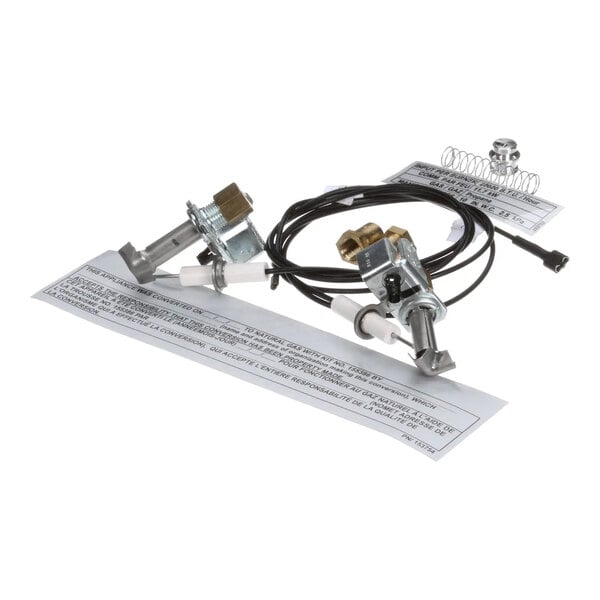 A gas conversion kit with metal components, wires, and instruction labels for converting Duke equipment from LP to natural gas.