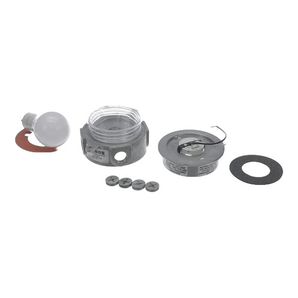 A Kason 1806LEDGU24 LED fixture kit with multiple components including a bulb, housing, screws, and gaskets.