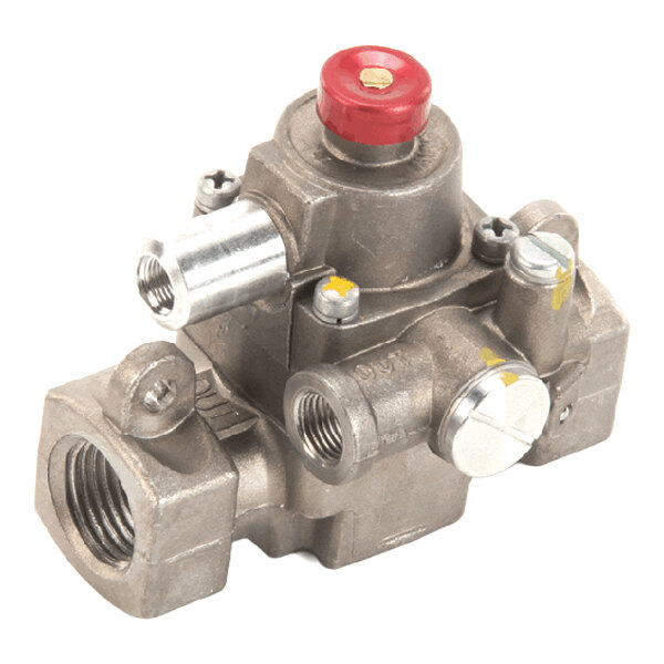 A metal safety valve with multiple threaded ports and a red cap, used for gas appliances.