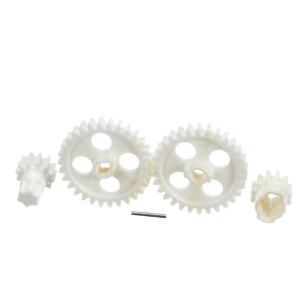 A set of white plastic gears and a metal rod for Dynamic Mixers models sd92Sc and E004.