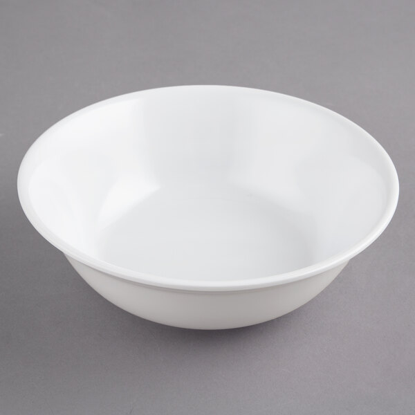 A white GET SuperMel bowl on a gray surface.