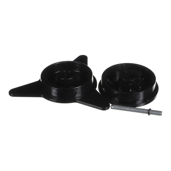 A black plastic core adapter kit with two round components and a metal rod, used for Heat Seal machines.
