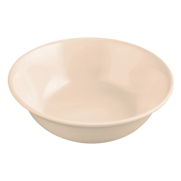 A close-up of a tan GET SuperMel bowl with a white rim.