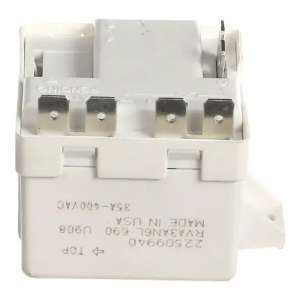 A Heatcraft 22509940 compressor start relay with metal terminals and a white plastic housing.