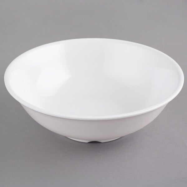 A white GET SuperMel bowl with a white rim on a gray surface.