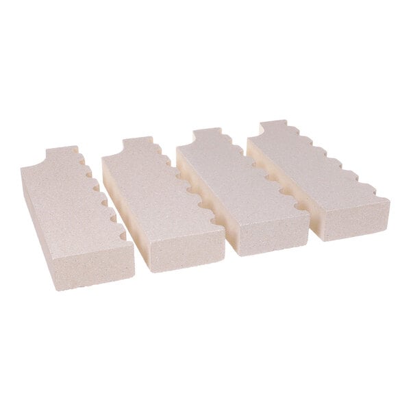 A set of four rectangular, beige support bricks with notched edges.