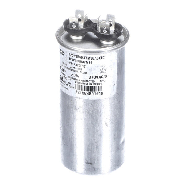 A cylindrical metal run capacitor labeled for 35 microfarads and 370 volts.