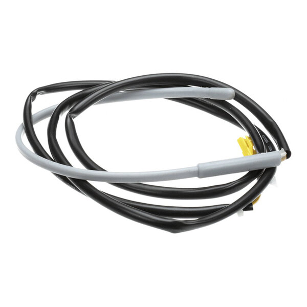 A black and gray defrost drain pipe heater for a Kelvinator appliance.