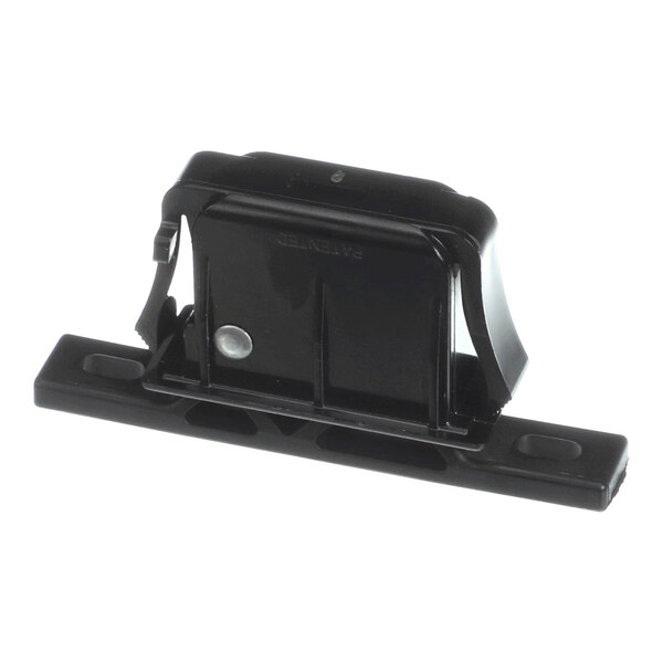A black plastic door latch catch component.
