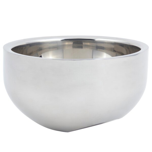 A silver stainless steel Bon Chef angled double wall bowl with a handle.