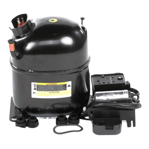 A Kelvinator freezer compressor with built-in overload protection, model KCBM72F.