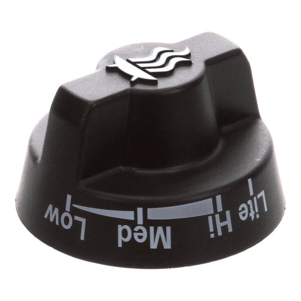 A black control knob labeled with temperature settings for outdoor use.