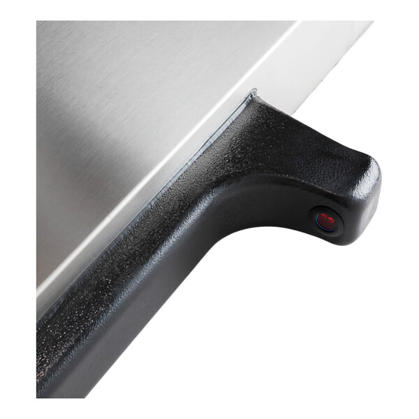 A close-up of a black handle attached to a stainless steel appliance or equipment.