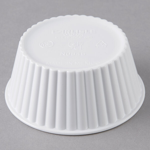 A white fluted plastic Carlisle ramekin.