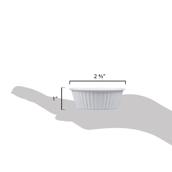 A hand holding a white fluted Carlisle ramekin.