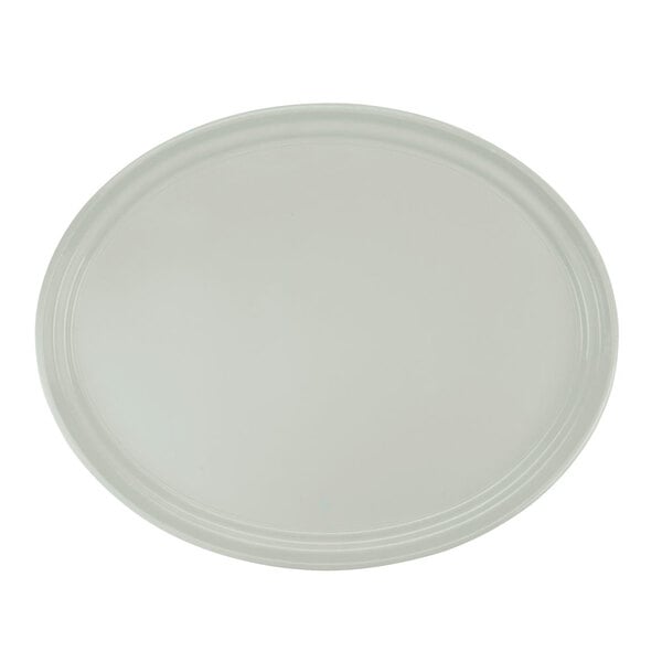 A white Cambro oval fiberglass tray with a white rim.