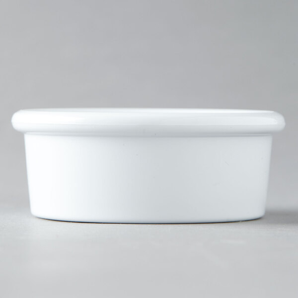 A white plastic Carlisle ramekin.
