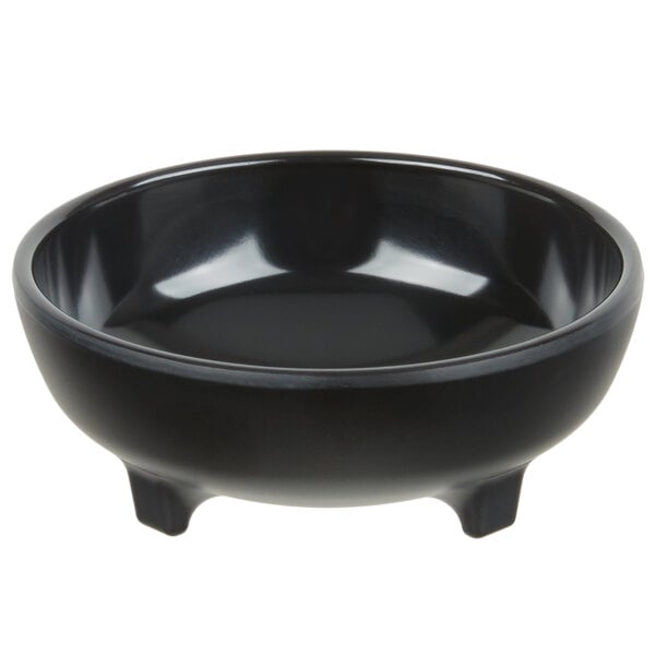 A close up of a black Carlisle molcajete ramekin.