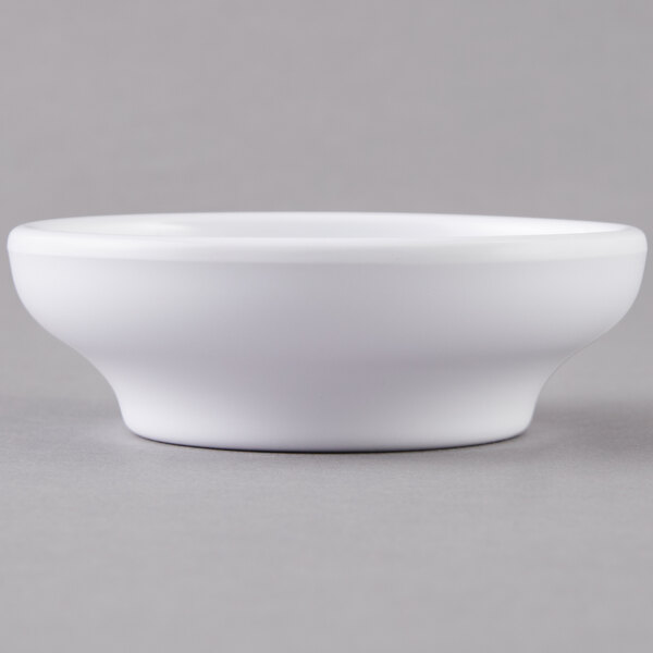 A close-up of a white Carlisle salsa bowl.