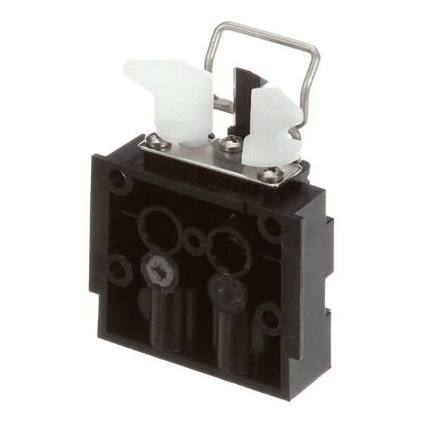 A black and white plastic and metal block component, identified as a Multiplex 5007842 Block Flo 380 with O-ring, used in beverage dispensing equipment.