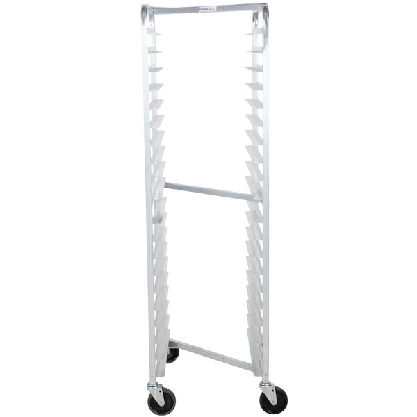 A tall, narrow aluminum sheet pan oven rack with multiple slots and four caster wheels.