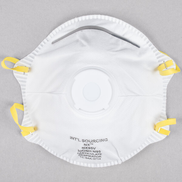 A white Cordova N-95 face mask with yellow straps.