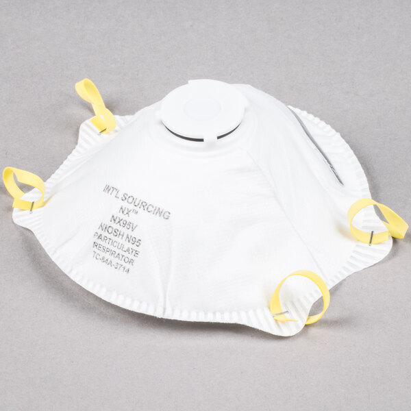 A white Cordova N-95 face mask with yellow straps.