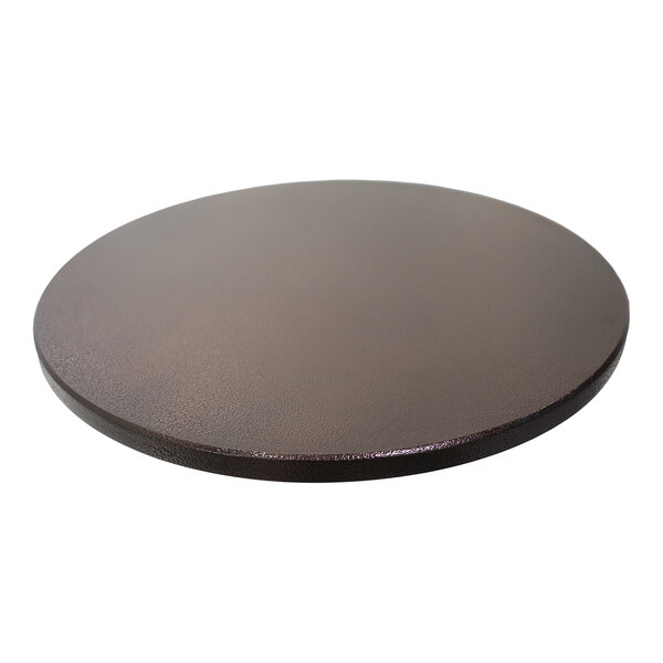 A round outdoor table top with an eased edge and a copper vein finish.