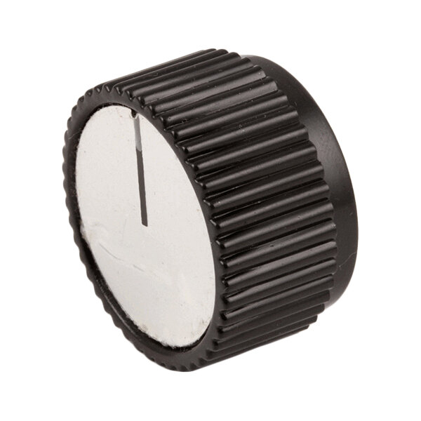 A black ribbed thermostat control knob with a white face and indicator line.