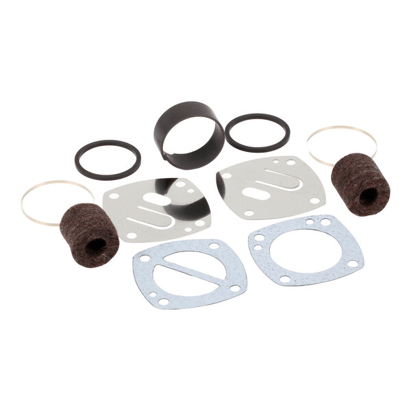 A Gast air rebuild kit containing various gaskets, seals, felt filters, and metal plates.