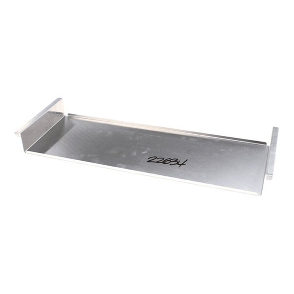 A rectangular metal heat shield holding pan with raised edges on both ends.