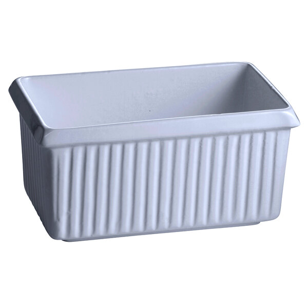 A white rectangular Tablecraft cast aluminum server with a ribbed bottom.