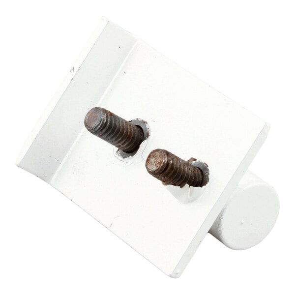 A white metal bracket with two protruding rusted screws, used for mounting casters.