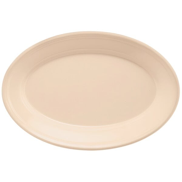 A tan oval platter with a white rim.